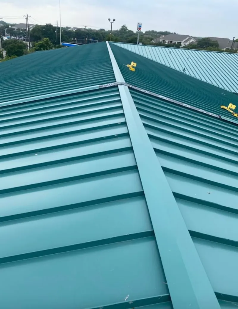Green commercial metal roof ridge and valley for Metal Roof Repair in The Meadows