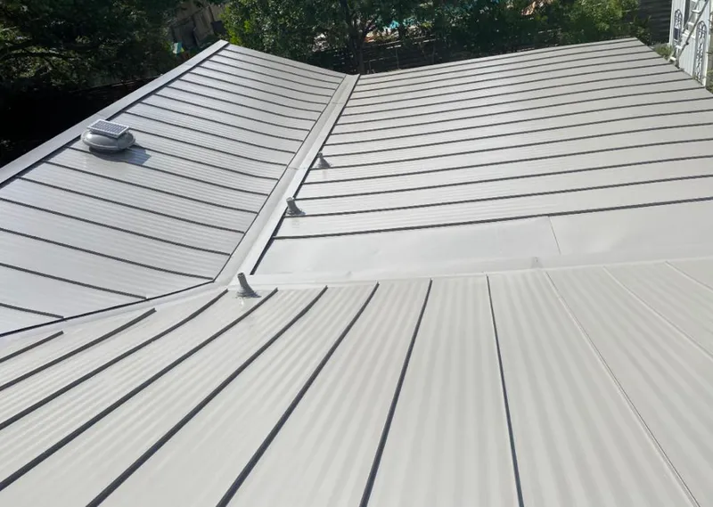 Solar attic fan installed on a metal roof for Roof Ventilation in The Meadows